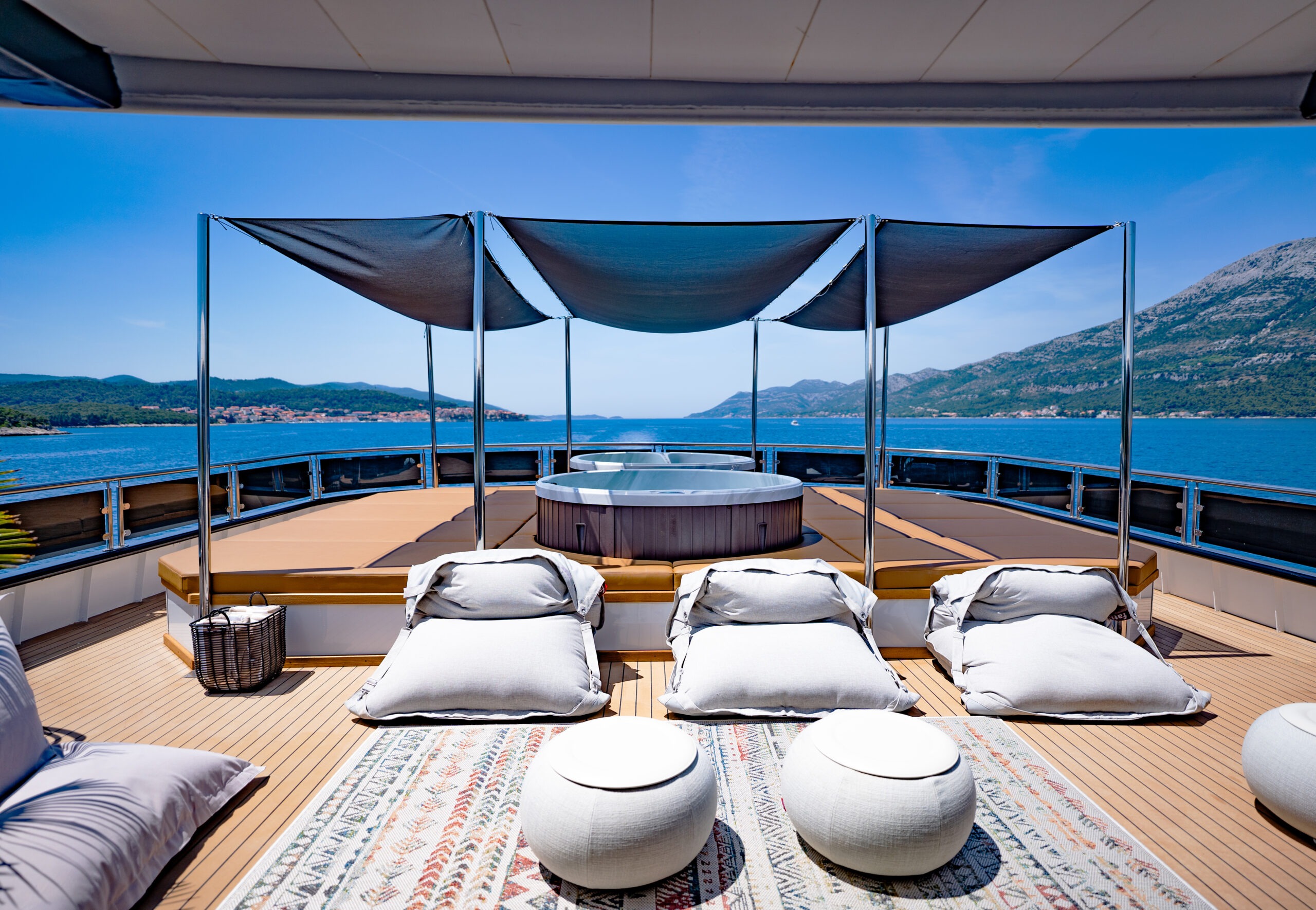 spacious sun deck featuring high-end loungers and sweeping sea views. Charter ARETHA luxury yacht in Croatia for a relaxing charter experience.
