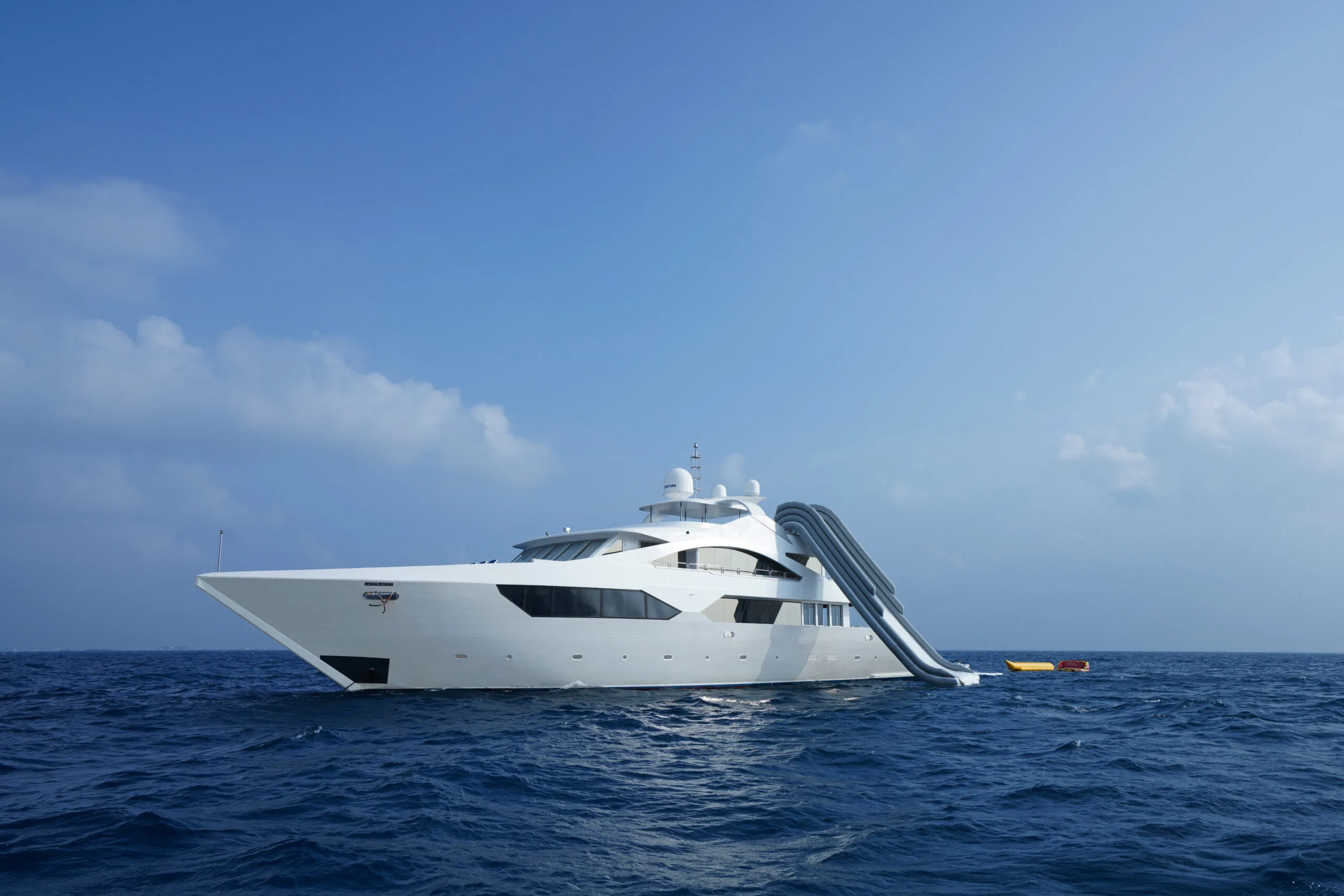 ARK NOBLE luxury yacht sailing on calm blue water in the Maldives.