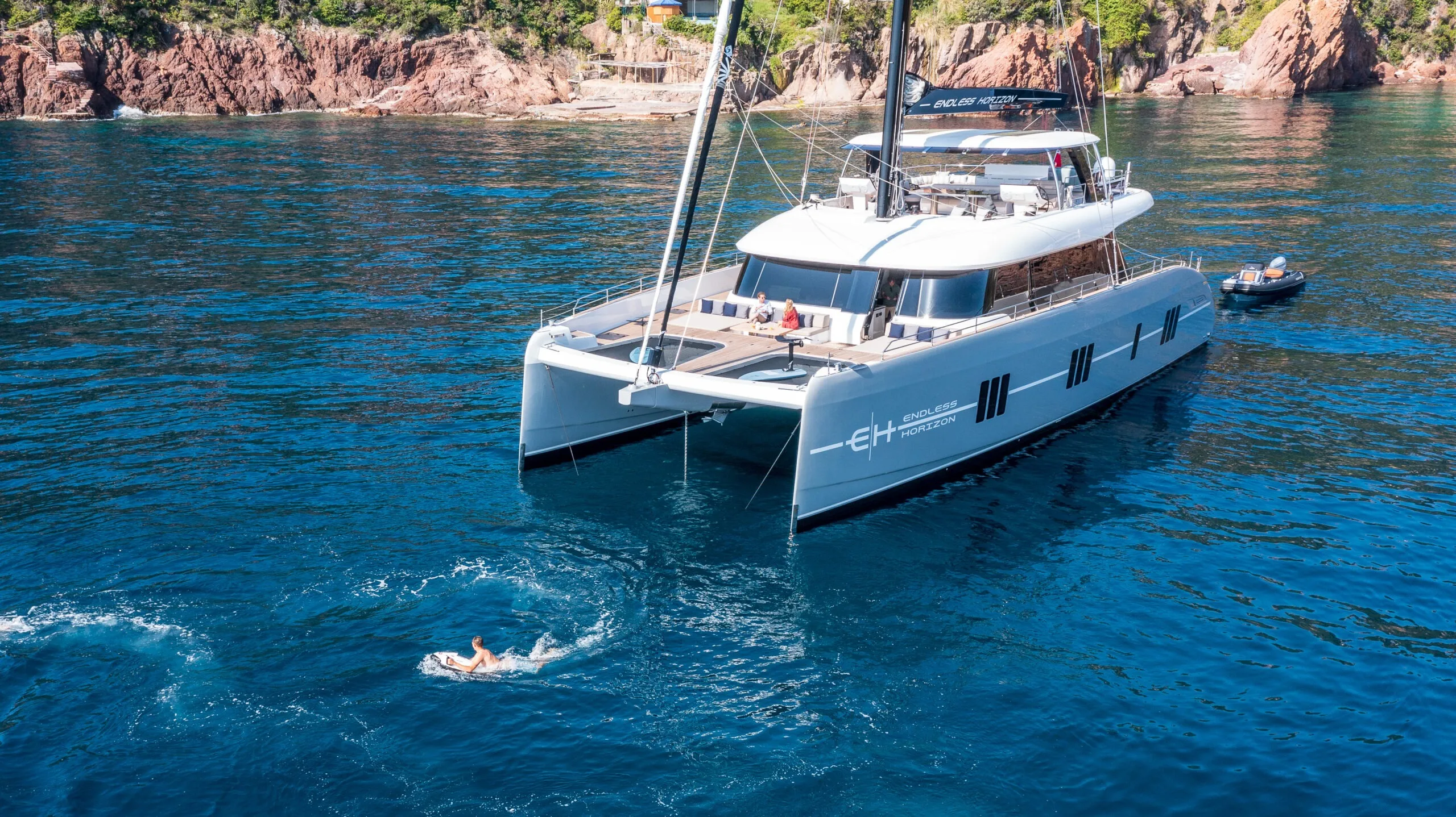 ENDLESS HORIZON Sunreef 80 anchored near tropical Caribbean coast.