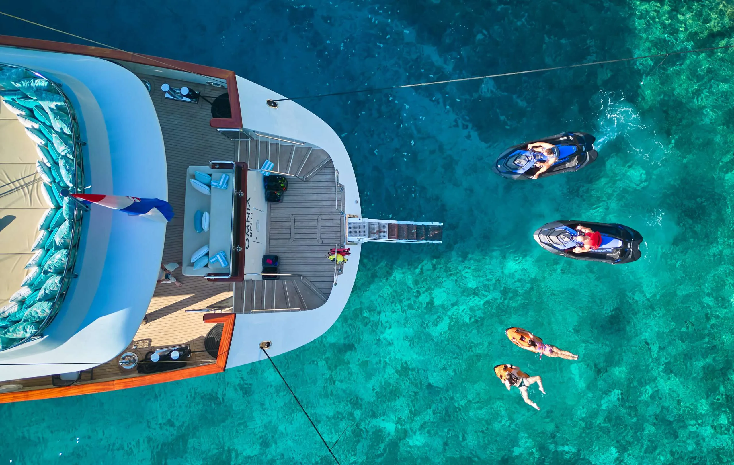 Aerial view of OMNIA water toys in turquoise water