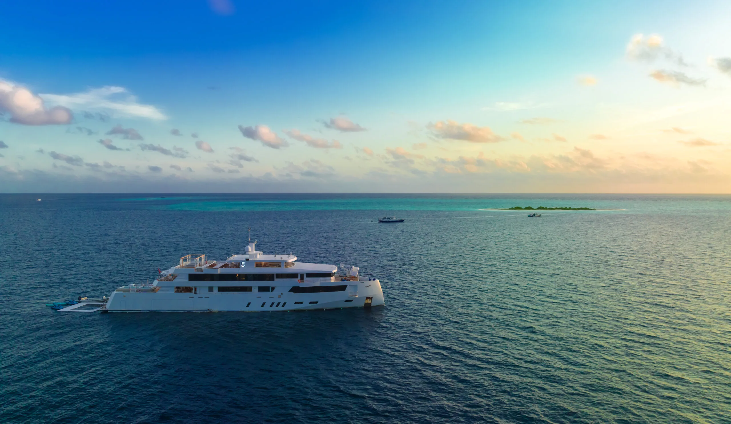 WHITE PEARL cruising at sunset in the Maldives.