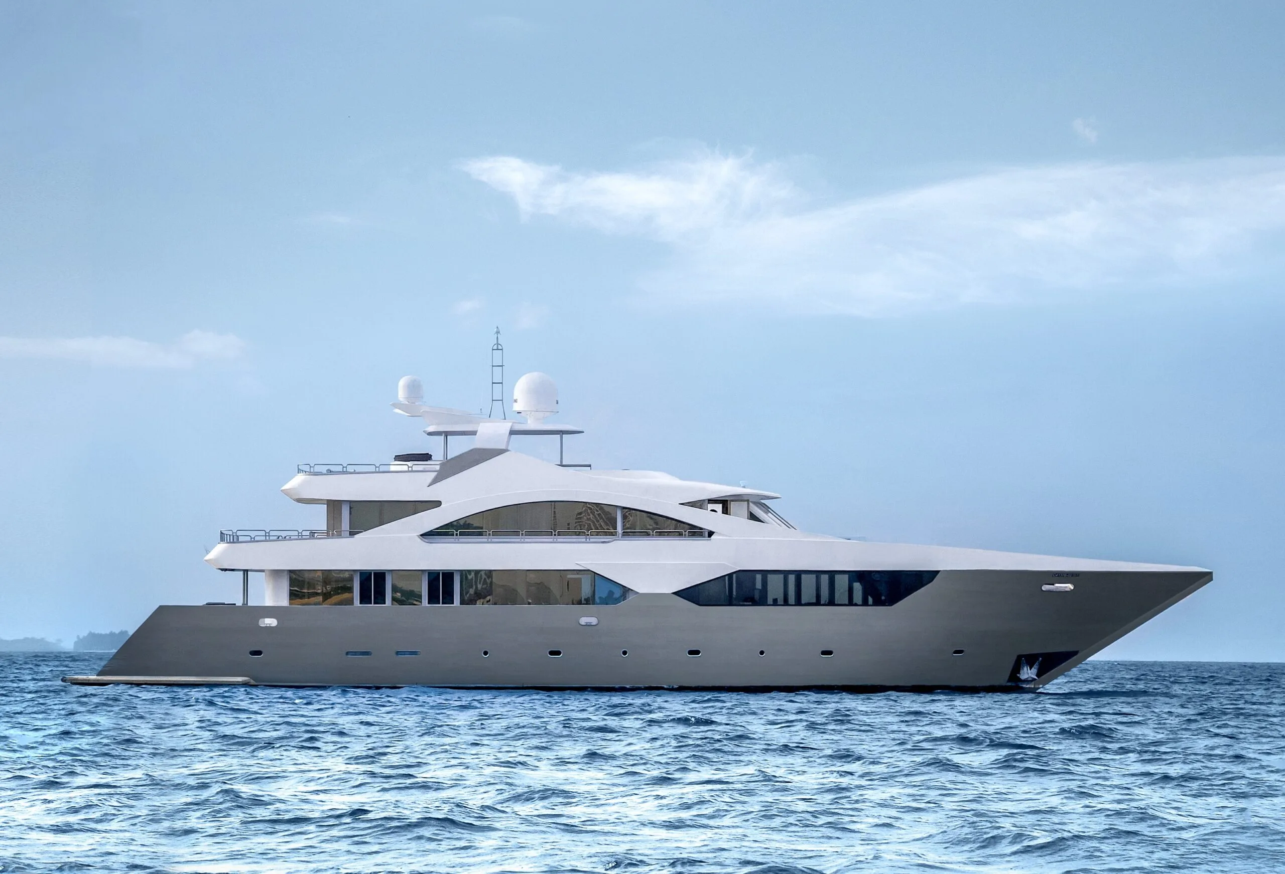 ARK NOBLE luxury superyacht cruising on clear blue Maldivian waters.