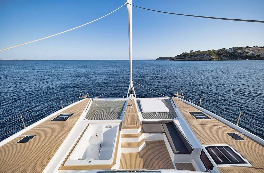 NEOW foredeck with sun pads and seating overlooking the water