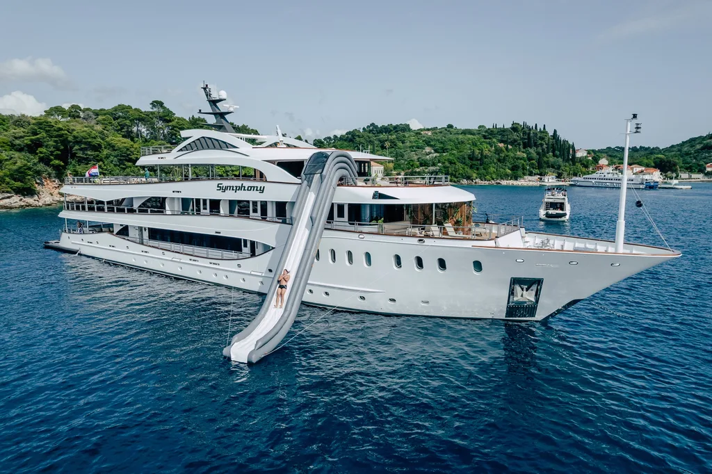 Sun deck of MS Symphony with jacuzzi and lounge beds during an Adriatic group charter yacht experience