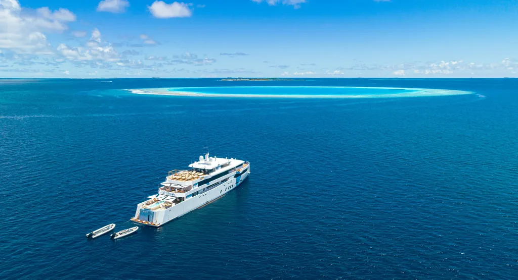 WHITE PEARL anchored near a turquoise sandbank in the Maldives.