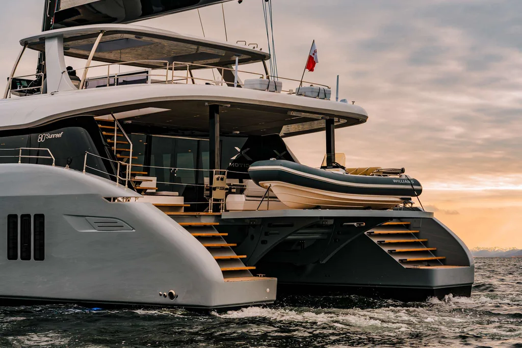 XMOTION yacht charter aft deck with tender platform at sunset